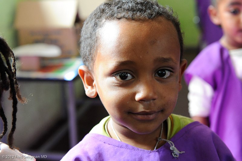 20120327_095324 Nikon D3S 2x3.jpg - Some of my photographic focus when visiting the project was on the enchanting faces of the  children.  I couldn't help but fantasize of the future dreams of these happy, studious children.  Hopefully these are in range with their dreams for themselves.   You too can dream for these kids.  Of my many trips around the world, this trip has focused me on the flatness of the world, and how kind and generous are the people of the United States of America (and other countries too) not only individually but also on the committment of the US government to improving the lives of others around the world.  But the paradox is that the people of so-called 3rd world countries have so much to teach us too.